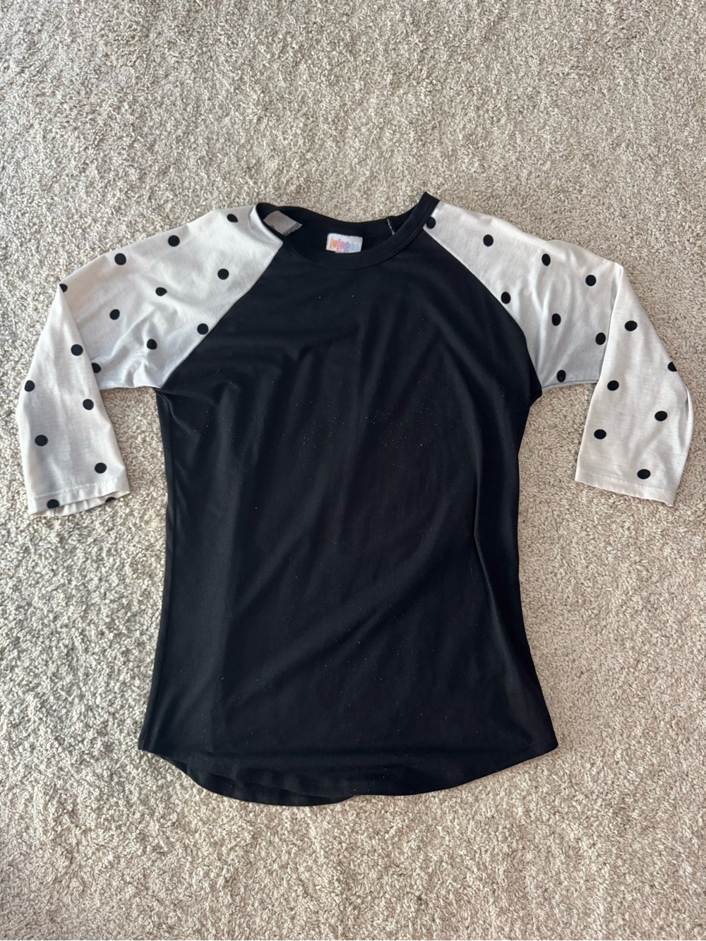 LuLaRoe Black Raglan Top with White Polka Dot Sleeves
